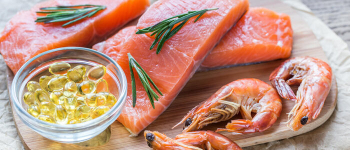 Sources of Omega-3 acid (salmon, shrimps, Omega-3 pills) on the